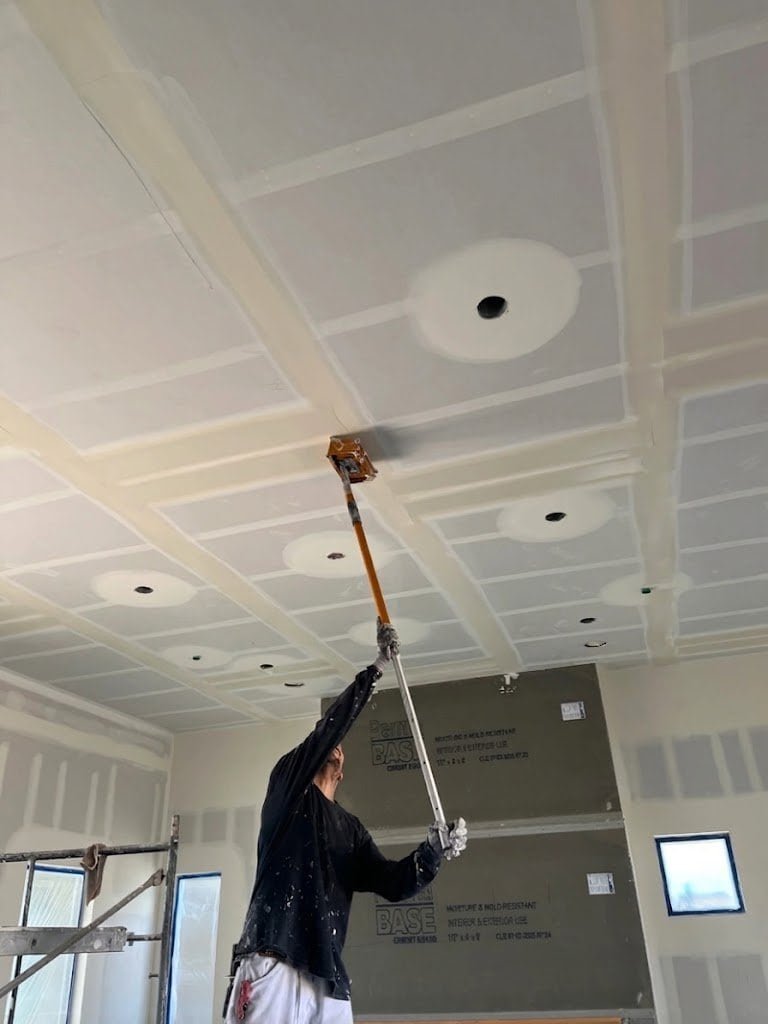 Procoat Drywall Inc. expertly painting drywall ceilings to transform interior spaces across Southern California.