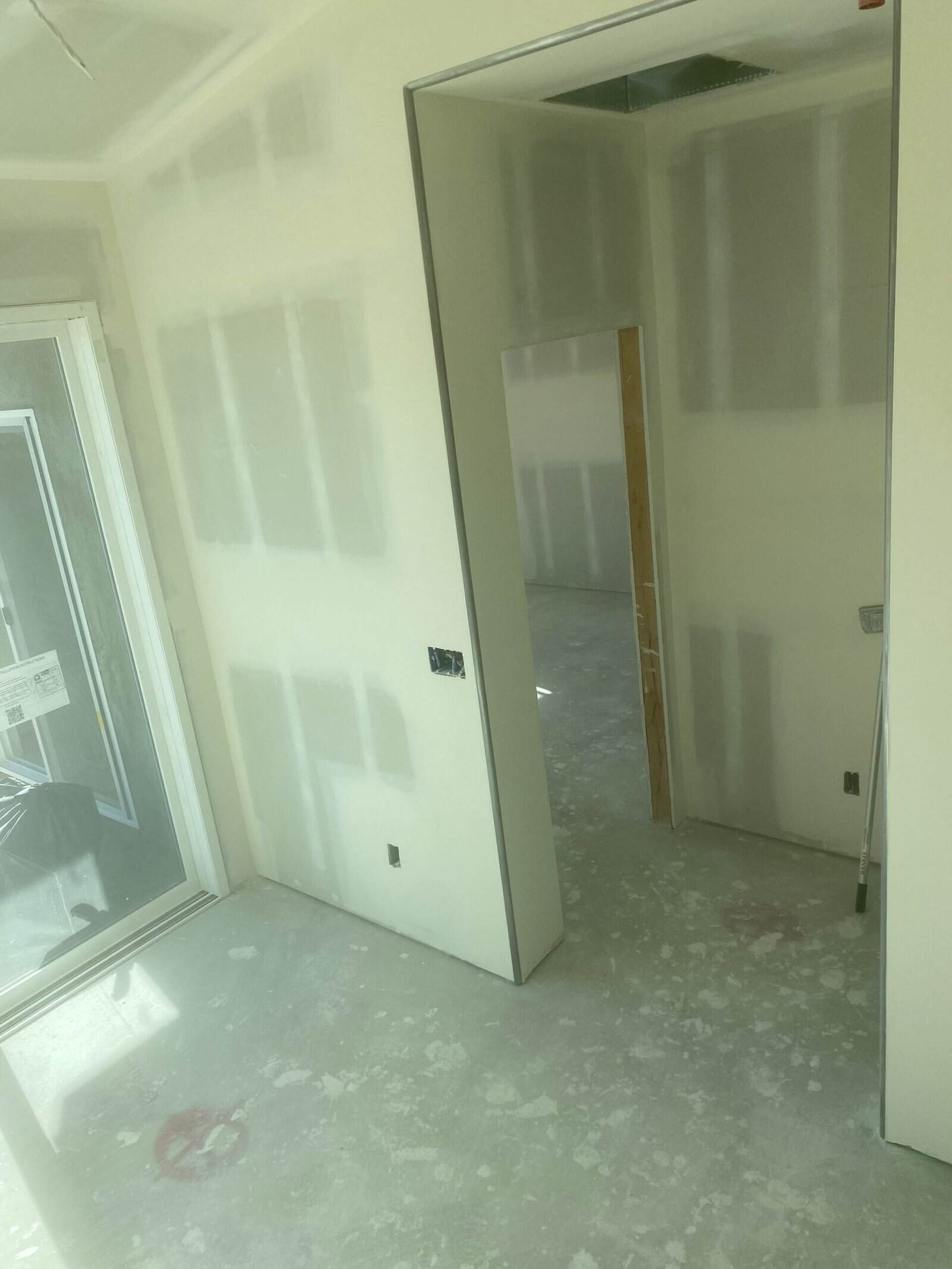 Drywall installation in progress at a construction site in Southern California.