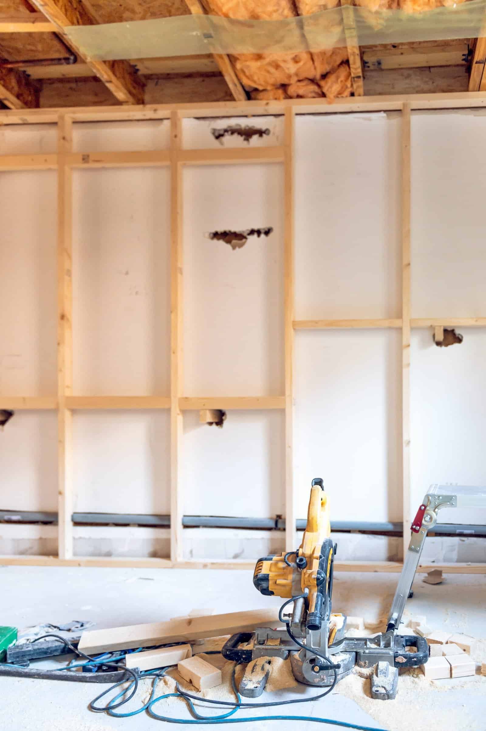 Construction site with drywall framing and power tools in Southern California.